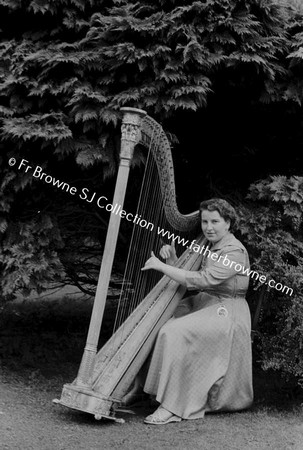 EILEEN MC CABE PLAYING HARP